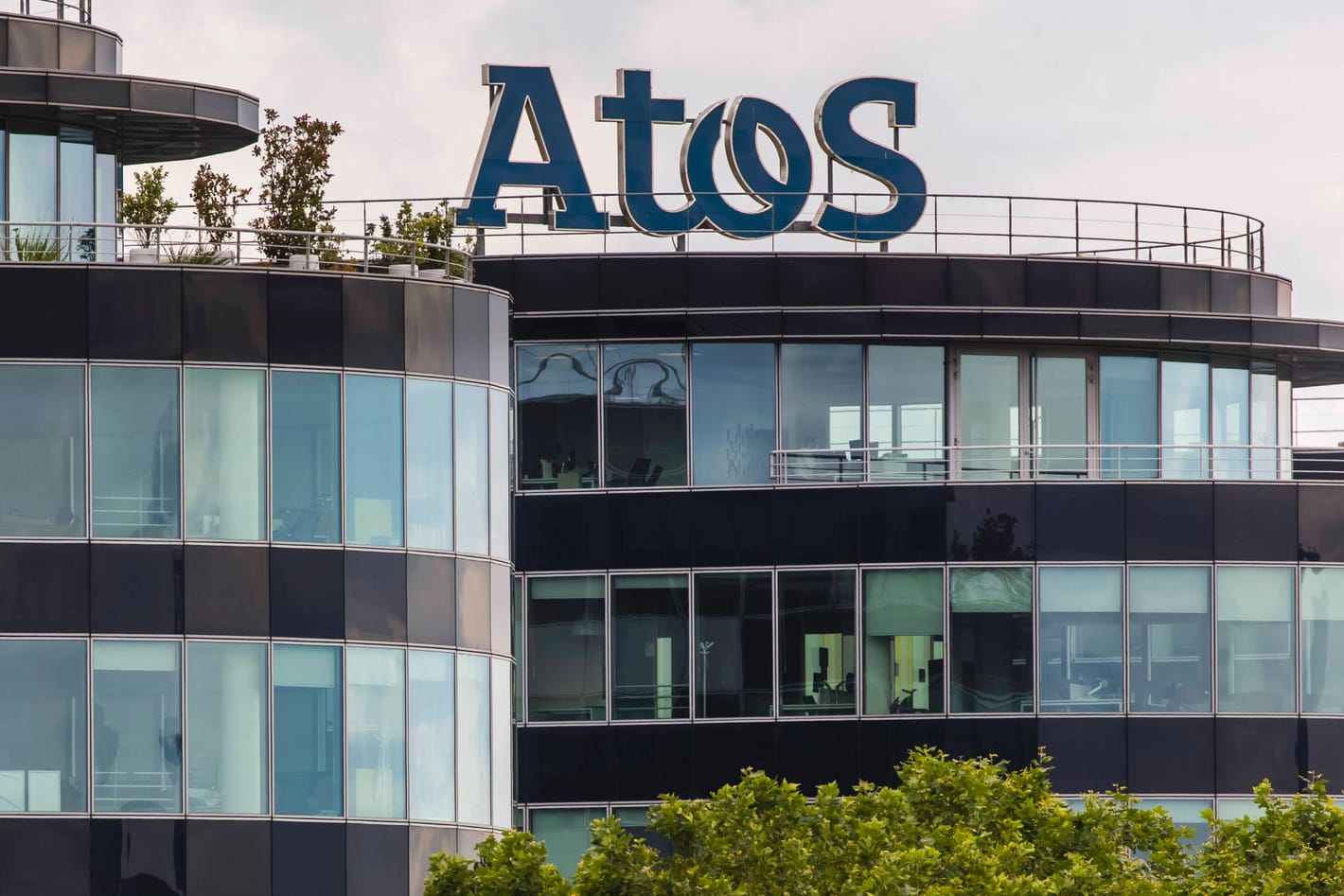Der Firmensitz von Atos im französischen Bezons: Das Unternehmen muss sparen. Der Firmensitz von Atos im französischen Bezons: Das Unternehmen muss sparen.