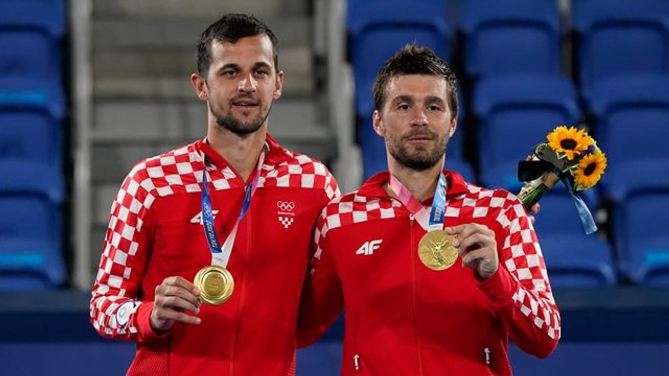 Die neuen Olympiasieger im Doppel: Mate Pavic (l) und Nikola Mektic.