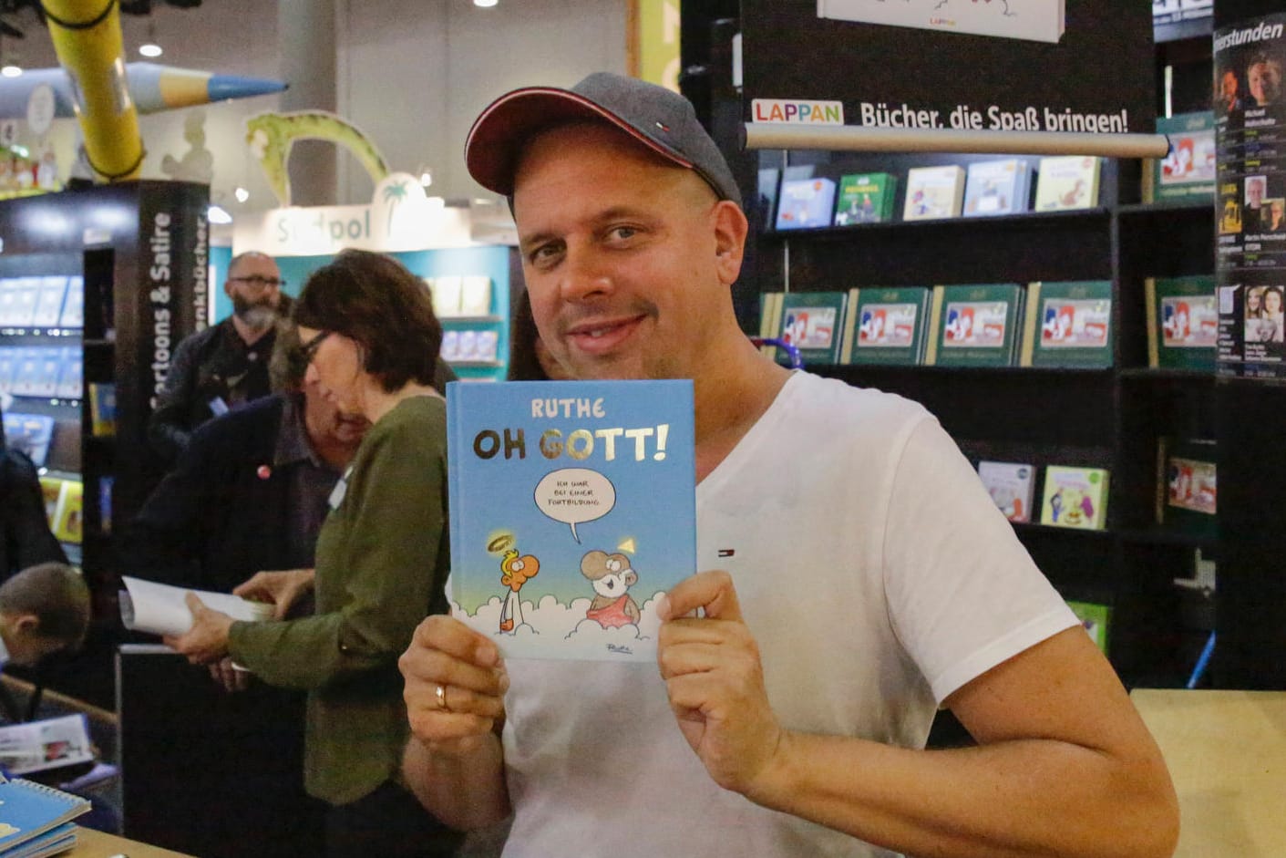 Germany: Frankfurt Book Fair 2019 Day 3 German cartoonist Ralph Ruthe holds up his latest book at the Frankfurt Book Fa