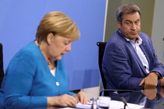 Angela Merkel und Markus Söder: So richtig zufrieden sind weder die Kanzlerin noch der bayerische Ministerpräsident nach der Bund-Länder-Runde.