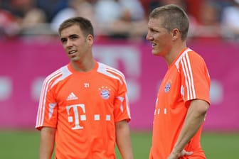 An Philipp Lahm (li.) und Bastian Schweinsteiger entzündet sich immer wieder die Führungsspielerdebatte.