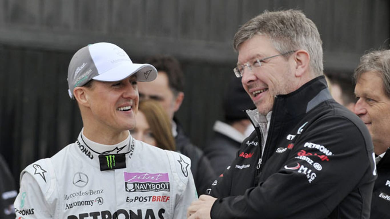 Ross Brawn (re.) adelt Michael Schumacher zu dessen Abschied.