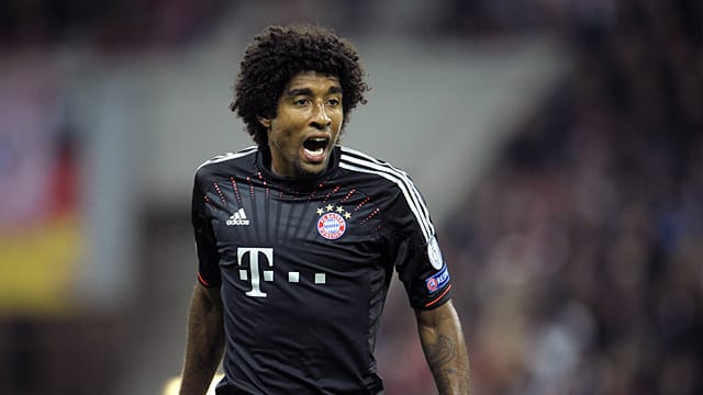 Der Brasilianer Dante ist von einer Gelb-Sperre in der Champions League bedroht.