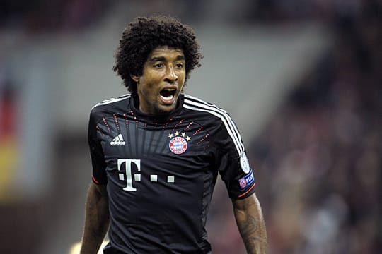 Der Brasilianer Dante ist von einer Gelb-Sperre in der Champions League bedroht.