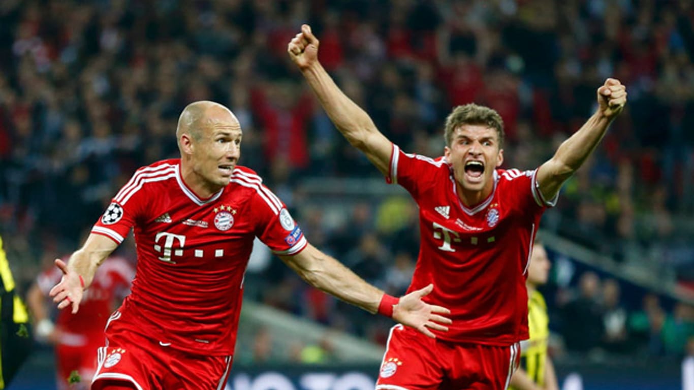 Robben und Müller feiern den Champions-League-Sieg.