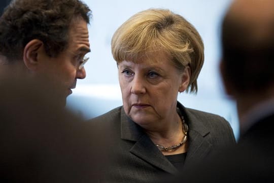 Bundesinnenminister Hans-Peter Friedrich und Bundeskanzlerin Angela Merkel
