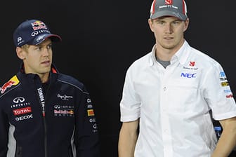 Sebastian Vettel (li.) macht dich für Nico Hülkenberg stark.