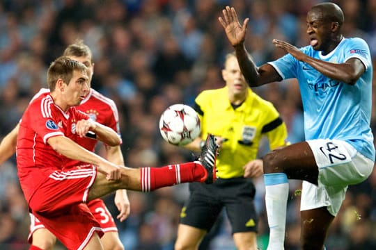 Auch im Rückspiel könnte es wieder zum Duell zwischen Philipp Lahm (li.) und Yaya Toure kommen.