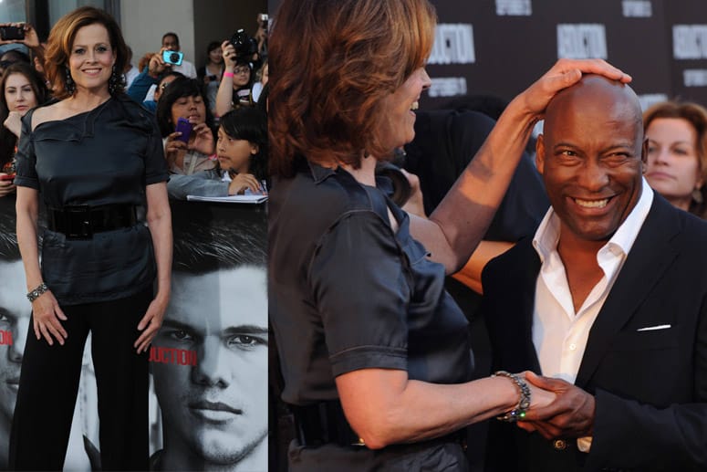 Sigourtney Weaver (1,82) tätschelt John Singleton (1,68) die Glatze.