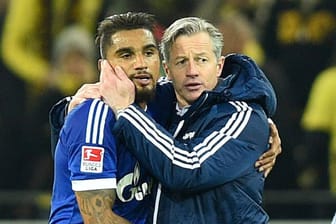 Nach dem Pokal-Aus müssen Schalke-Coach Jens Keller (re.) und Kevin-Prince Boateng gegen Hannover 96 ran.