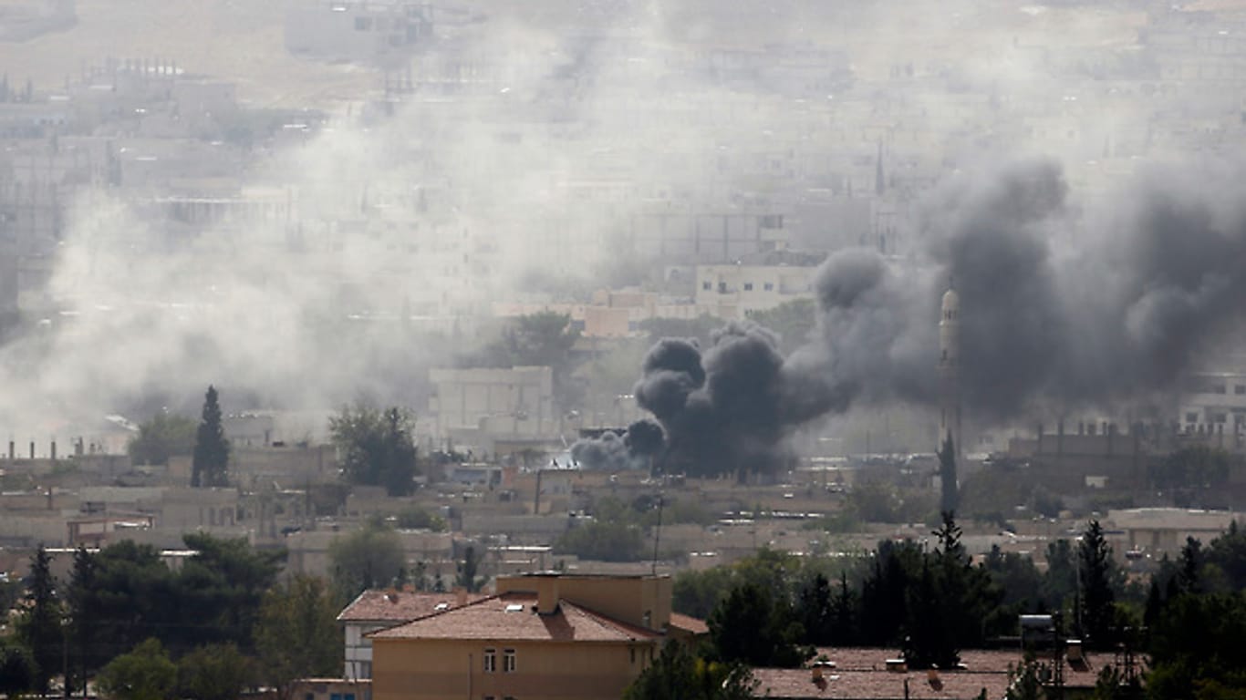Kurdische Zivilisten sind in und um Kobane von IS-Kämpfern eingekesselt