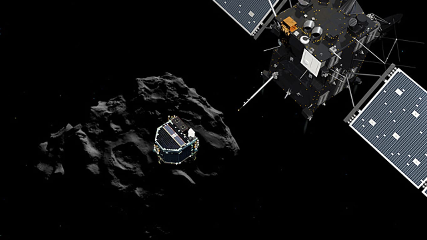 Die Raumsonde Rosetta fliegt über dem Kometen Tschuri durchs All. Dort ist "Philae" gelandet. (Illustration)
