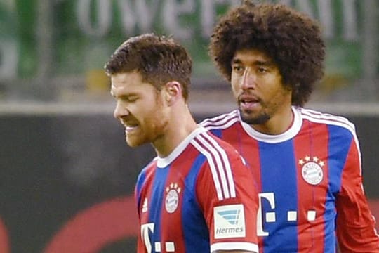 Nicht die sprintstärksten: Xabi Alonso (li.) und Dante (re.)