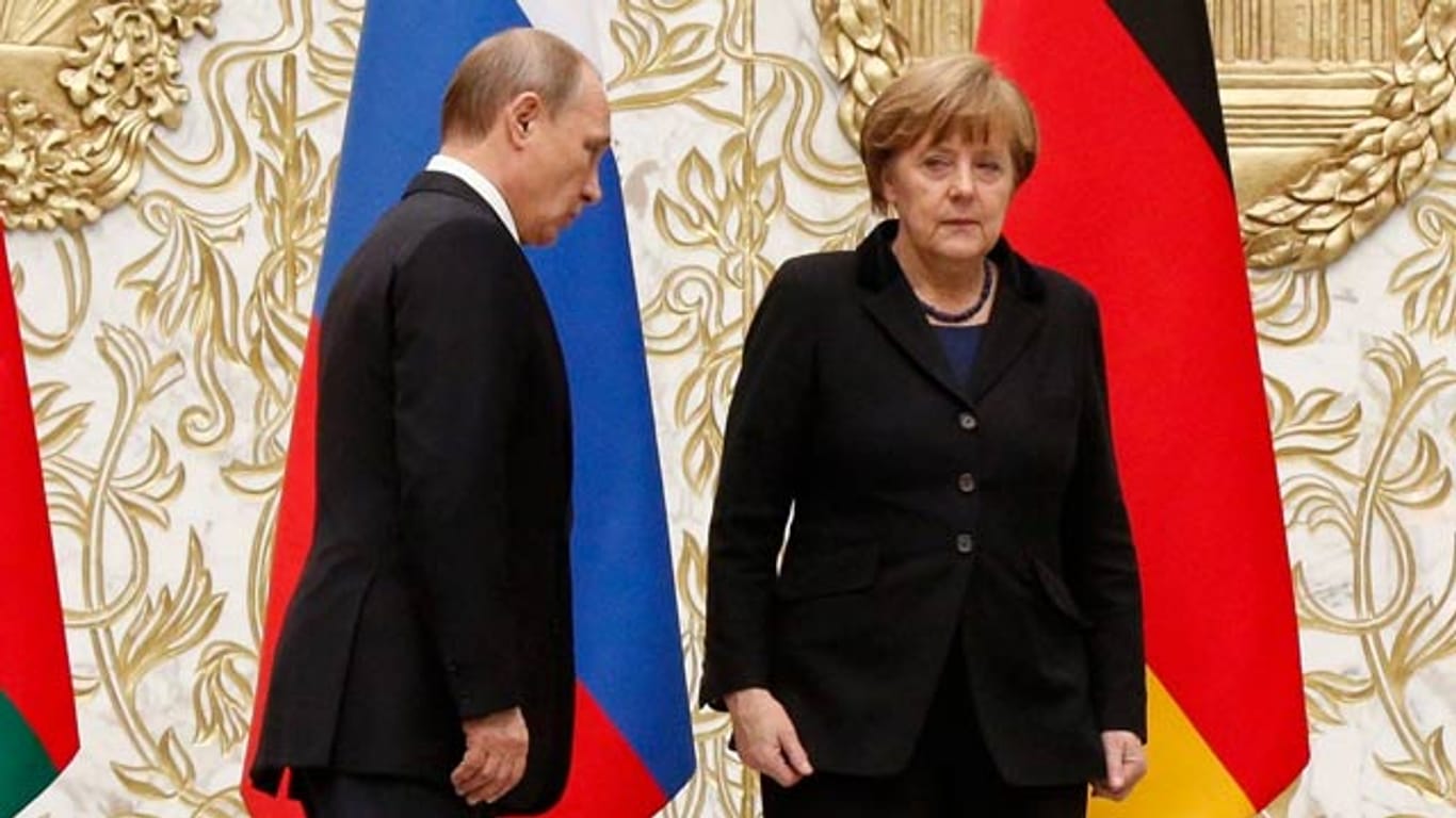 Sichtlich mitgenommen: Angela Merkel und Wladimir Putin.