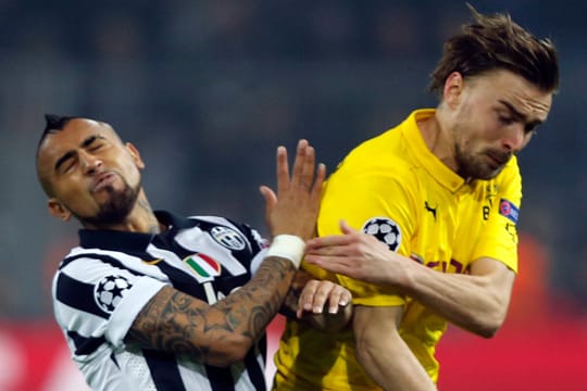 Marcel Schmelzer (li. im Zweikampf mit Aturo Vidal) verletzte sich im Spiel gegen Juventus Turin.