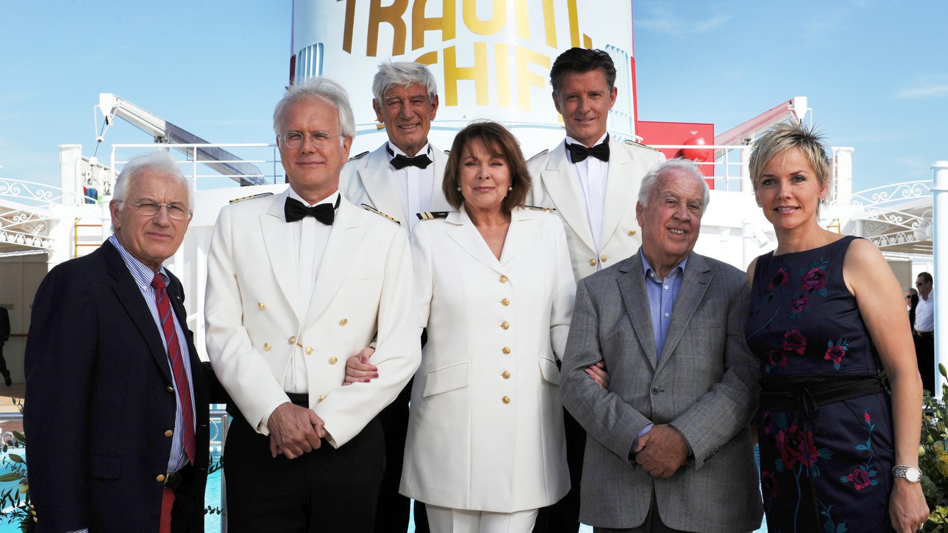 Wolfgang Rademann (2. v. re.) im August 2011 auf dem Pooldeck des Kreuzfahrtschiffes "MS Deutschland" anlässlich der Jubiläumsfolge zum 30. Geburtstag von "Das Traumschiff". Auf dem Foto zu sehen sind außerdem (v.l.n.re.) der Regisseur Hans-Jürgen Tögel und die Schauspieler Harald Schmidt (als Kreuzfahrtdirektor Schifferle), Siegfried Rauch (als Kapitän Paulsen), Heide Keller (als Chefstewardess Beatrice), Nick Wilder (als Schiffsarzt Dr. Sander) und Inka Bause (als Fitnesstrainerin Inka).