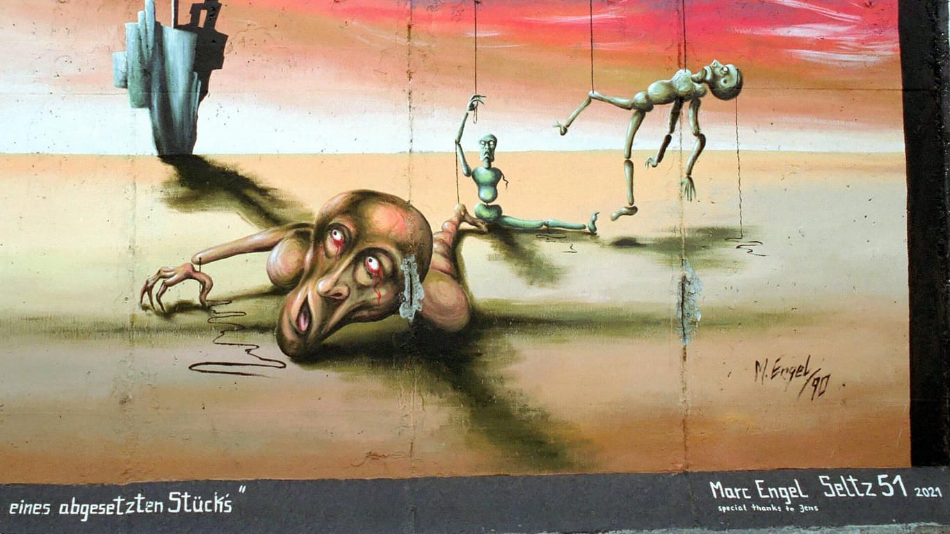 Surrealistische Motive sind auch an der Berliner Mauer zu finden.
