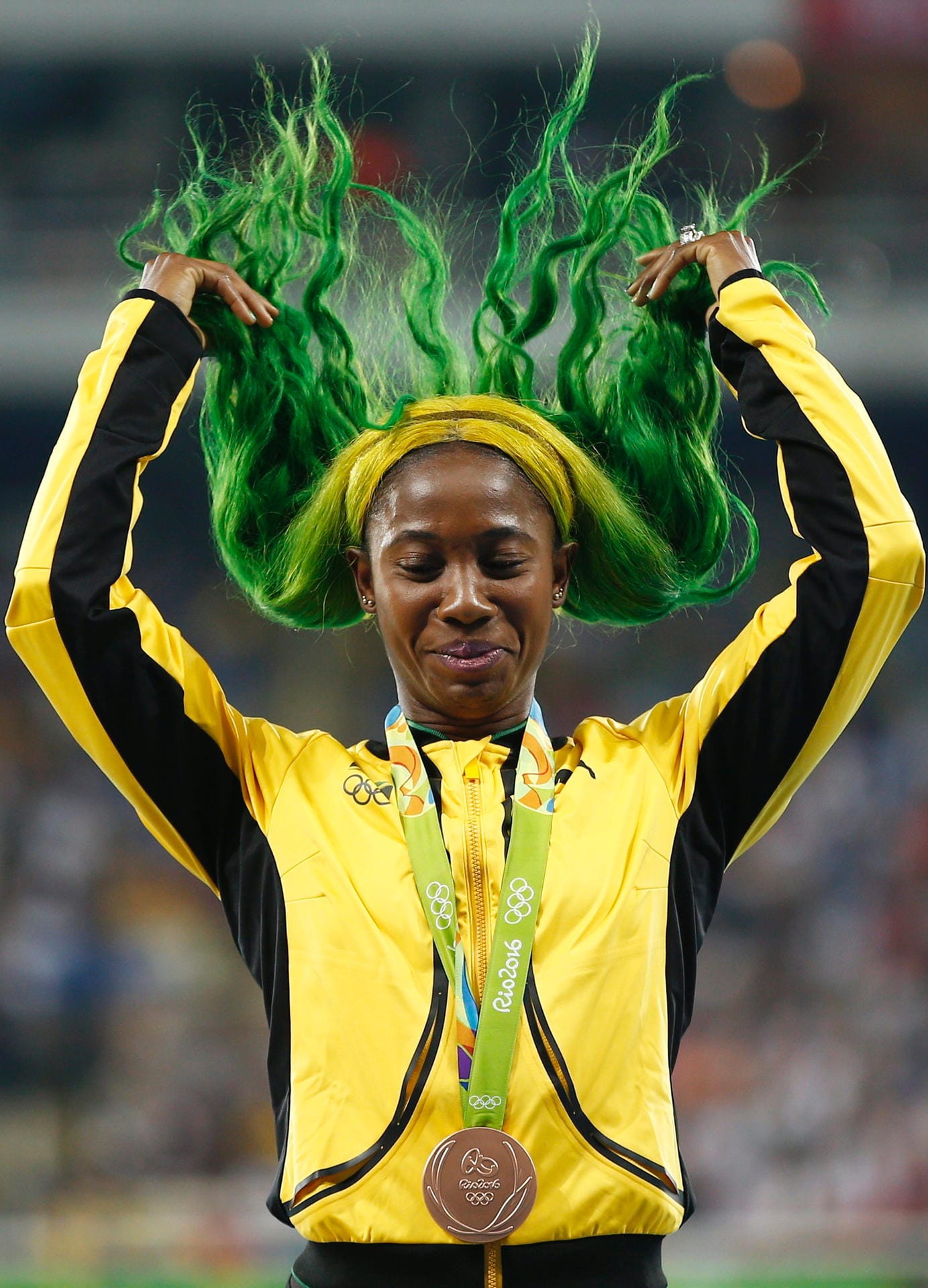 Und wieder sind es die Haare: Bronze-Gewinnerin Shelly-Ann Fraser-Pryce aus Jamaika steht wohl auf ihre Landesfarben.