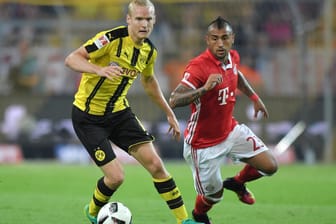Spitzenteams: Anders als in der Bundesliga-Tabelle liegt Borussia Dortmund (links Sebastian Rode) in der Rangliste der Top-Marken vor dem FC Bayern (rechts Arturo Vidal).