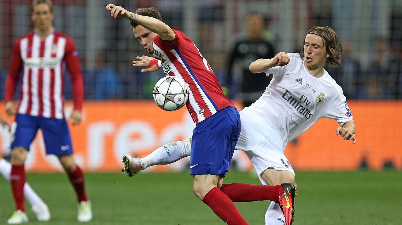 Ballkontakt: Im vergangenen Finale der Champions League setzte sich Real Madrid (rechts Luka Modric) gegen den Stadtrivalen Atletico (links Saul Niguez) durch.