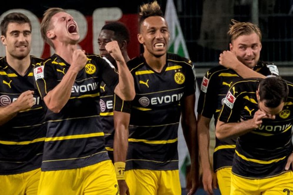 Die Spieler von Borussia Dortmund wollen gegen den SC Freiburg ihren Höhenflug fortsetzen.