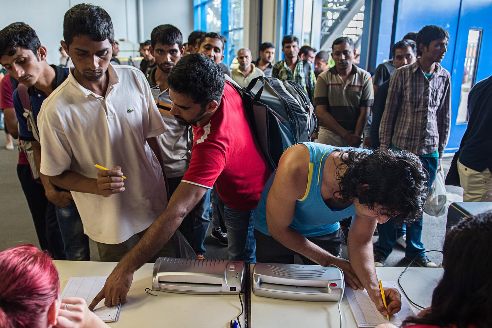 Flüchtlinge registrieren sich in Stuttgart.