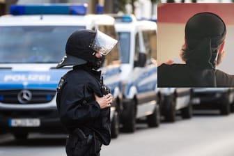 Polizist beim Einsatz in Hildesheim. Zu den Festgenommenen gehört der "Prediger ohne Gesicht".