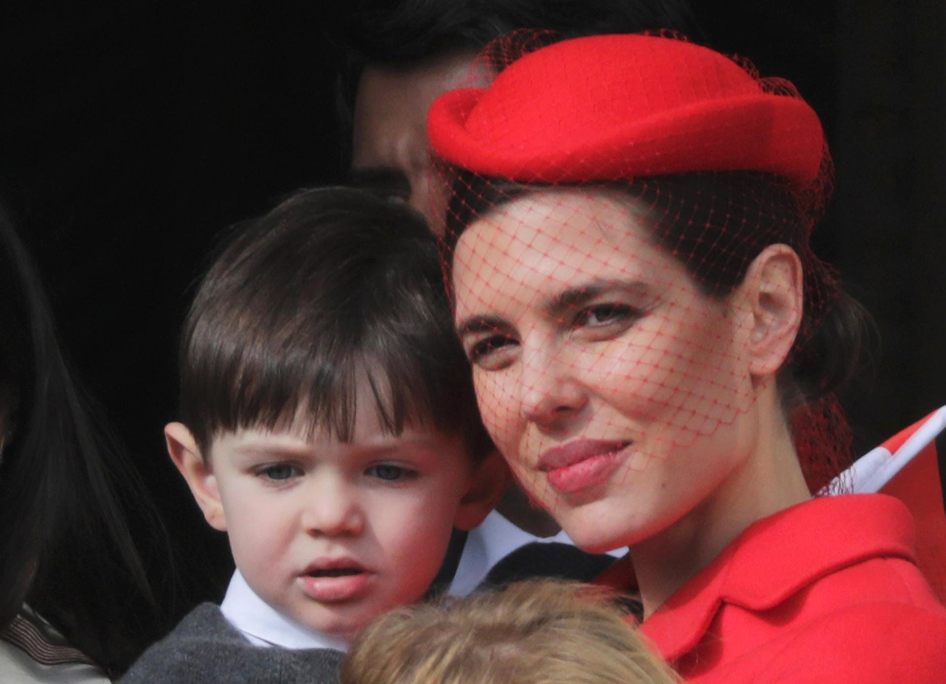 Charlotte Casiraghi and her son Raphael stand at the Palace Balcony during Monaco's National Day