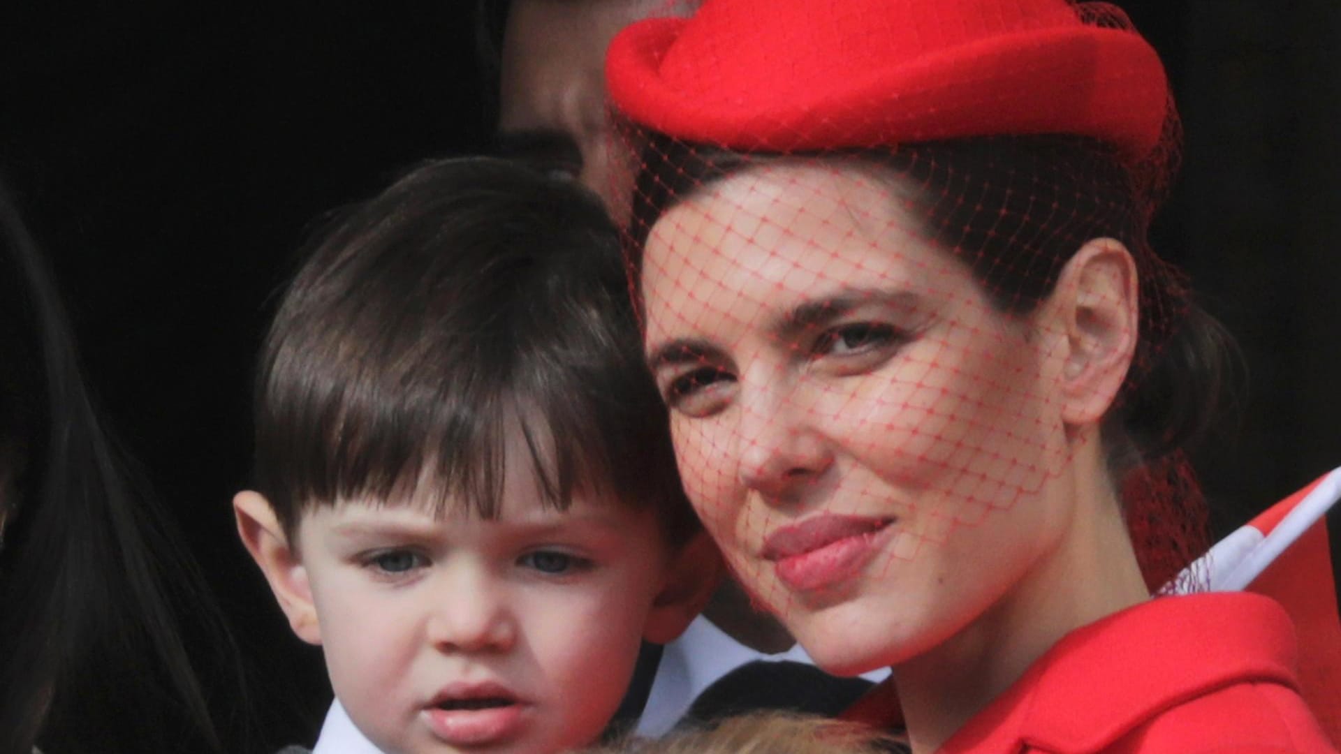 Charlotte Casiraghi and her son Raphael stand at the Palace Balcony during Monaco's National Day