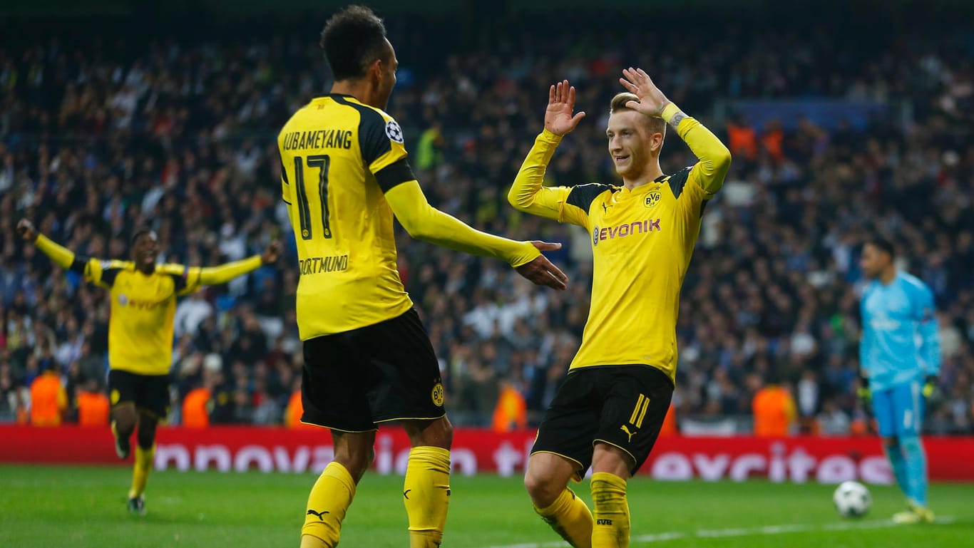 Torschützen unter sich: Pierre-Emerick Aubameyang und Marco Reus (rechts) sicherten Dortmund mit ihren Treffern noch ein Remis in Madrid.