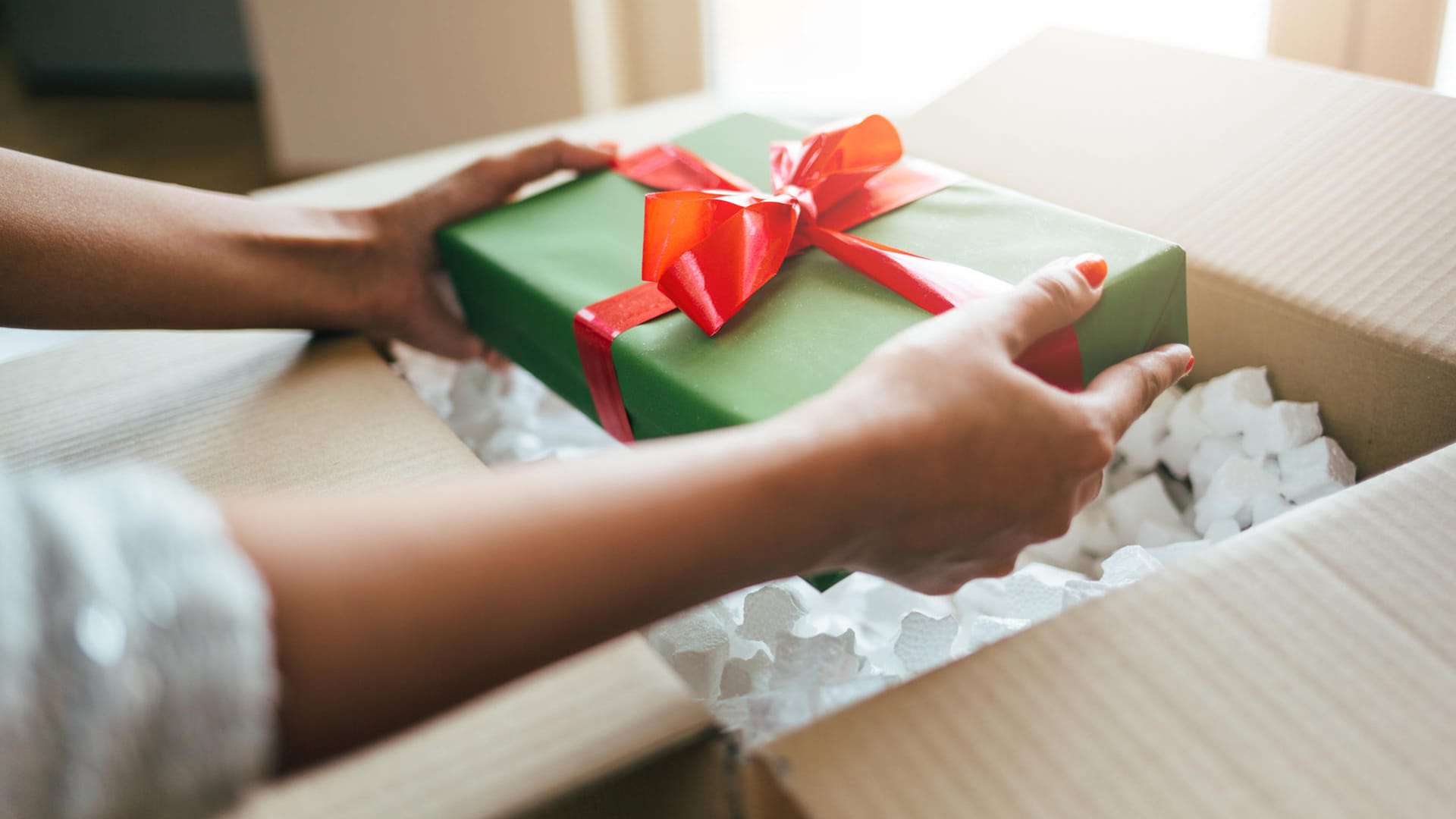 Close up of hands holding gift box