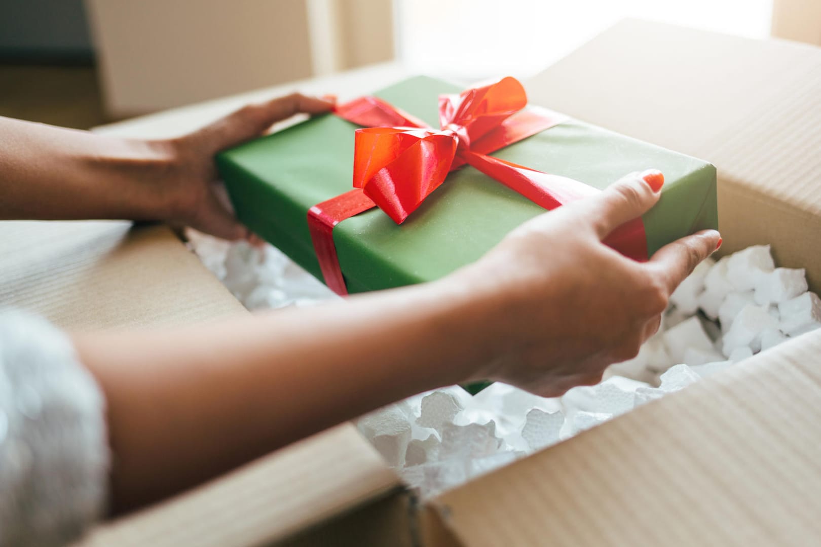 Close up of hands holding gift box