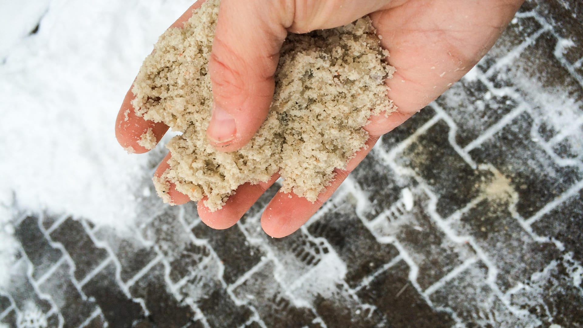 Hand with road salt