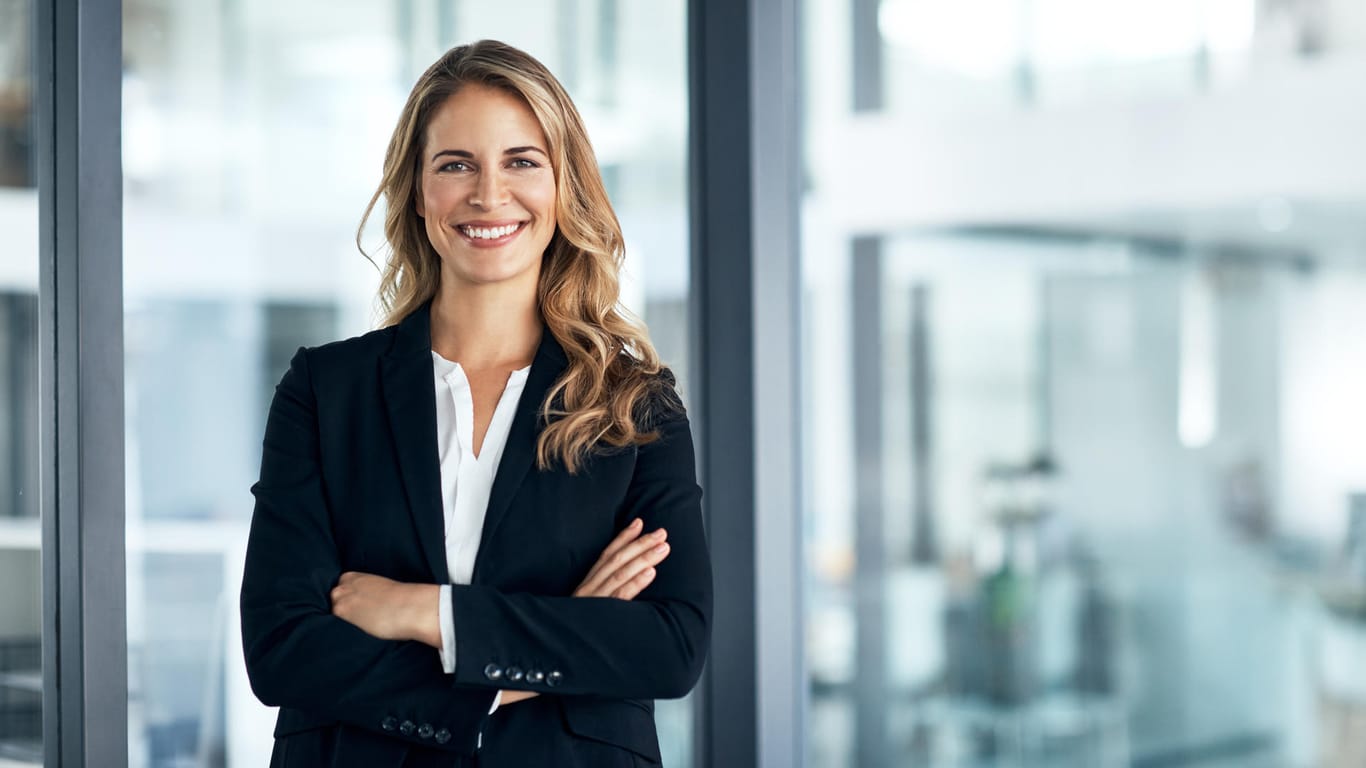 Smart Casual: Pants suit or dark suit are not overdressed.