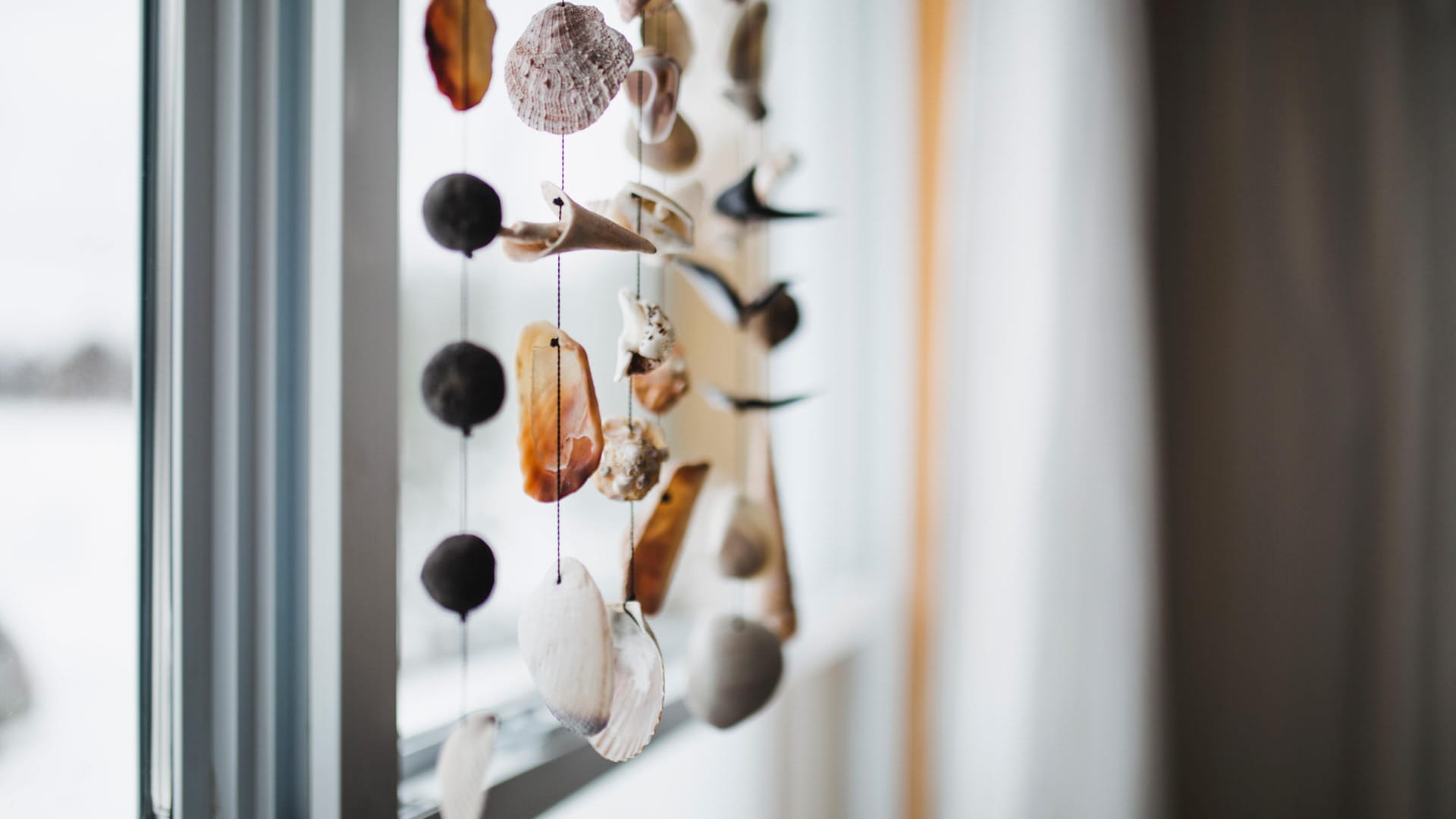 Beautiful seashell mobile in a window