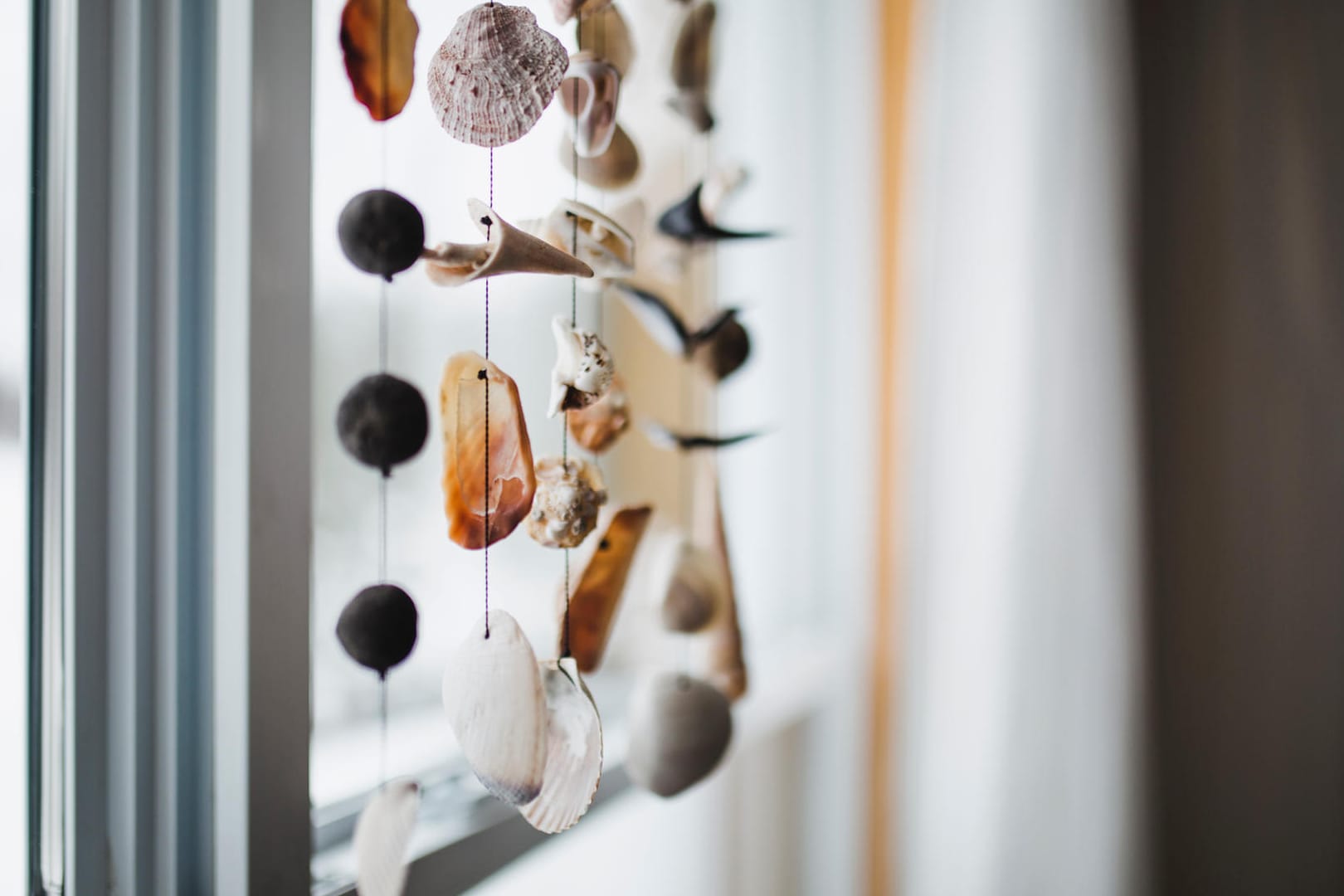 Beautiful seashell mobile in a window