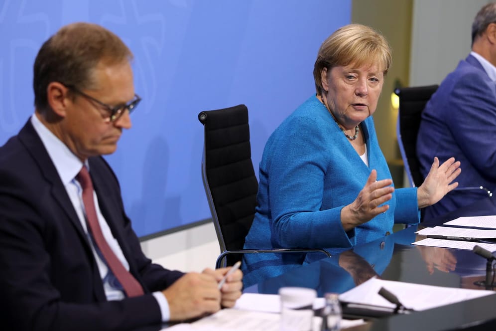 Michael Müller, Angela Merkel und Markus Söder in Berlin.