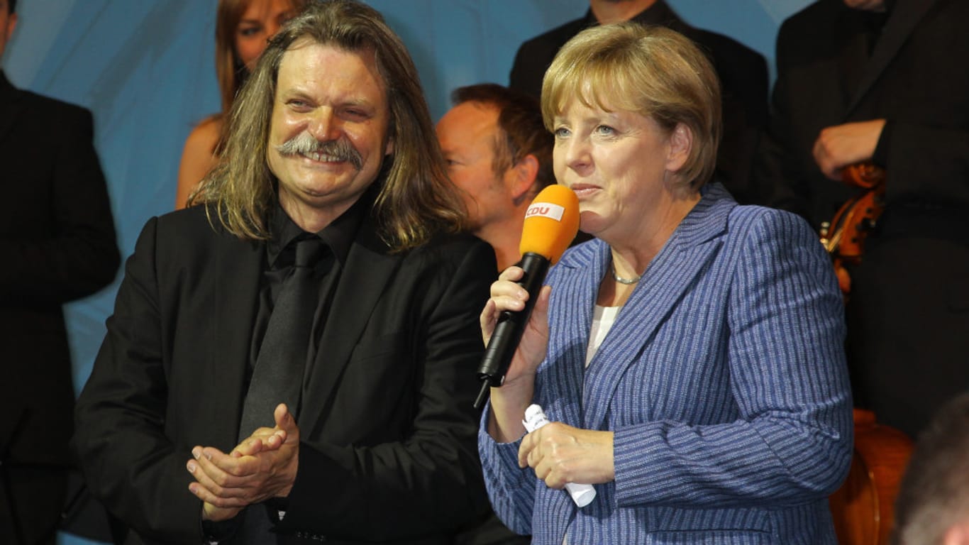 Leslie Mandoki und Angela Merkel im Jahr 2011