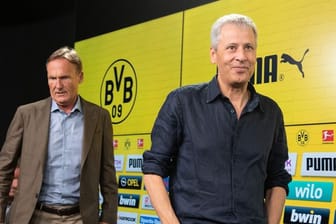 Will den Vertrag von Coach Lucien Favre (r) vorzeitig verlängern: BVB-Boss Hans-Joachim Watzke.