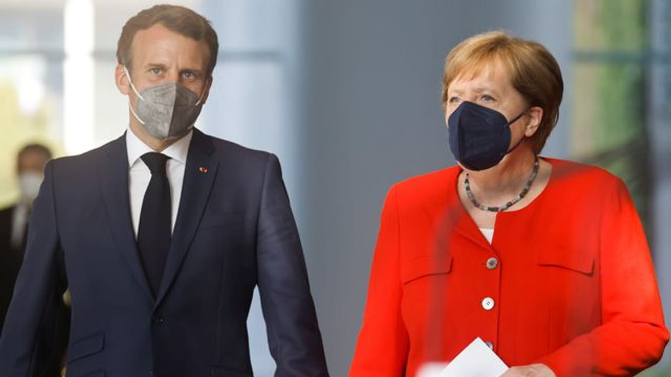 Bundeskanzlerin Angela Merkel und Frankreichs Präsident Emmanuel Macron zusammen in Berlin.