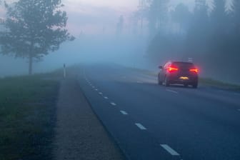 Tartumaa 22 05 2019 Fog foggy night nature spring norhtern twilight sunset Car on the road wi