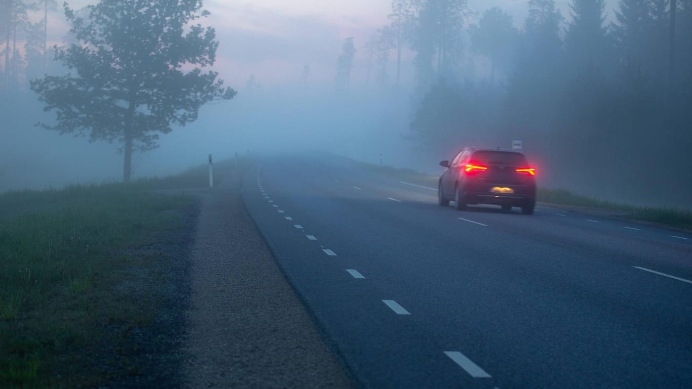 Tartumaa 22 05 2019 Fog foggy night nature spring norhtern twilight sunset Car on the road wi