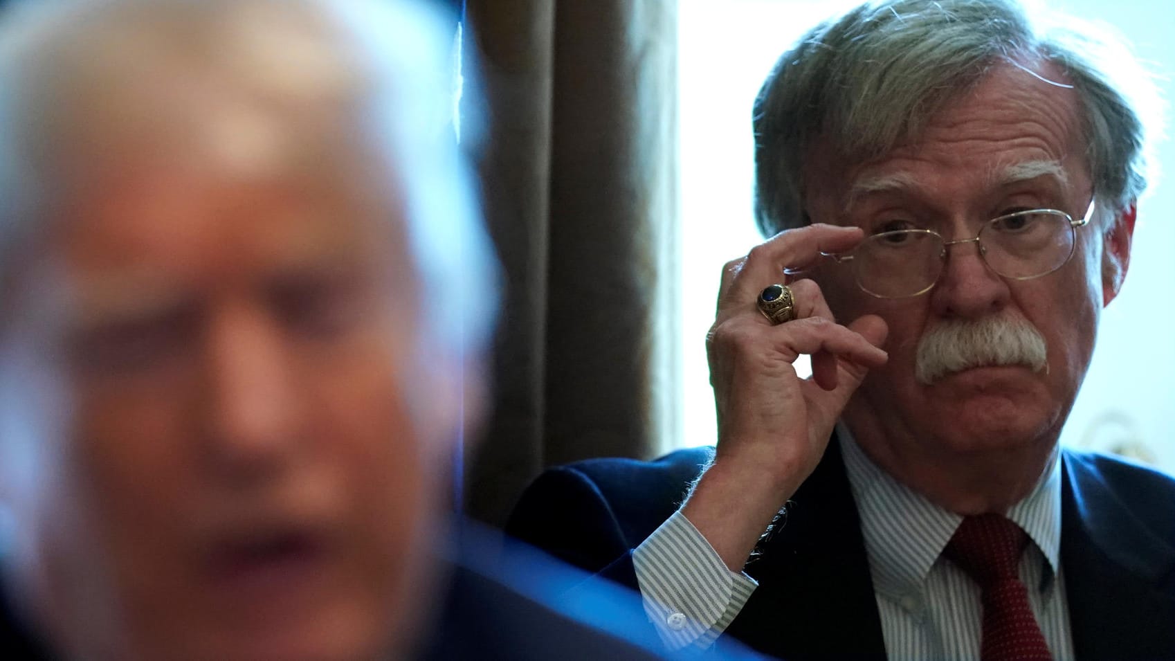 Bolton listens as Trump holds a cabinet meeting at the White House in Washington