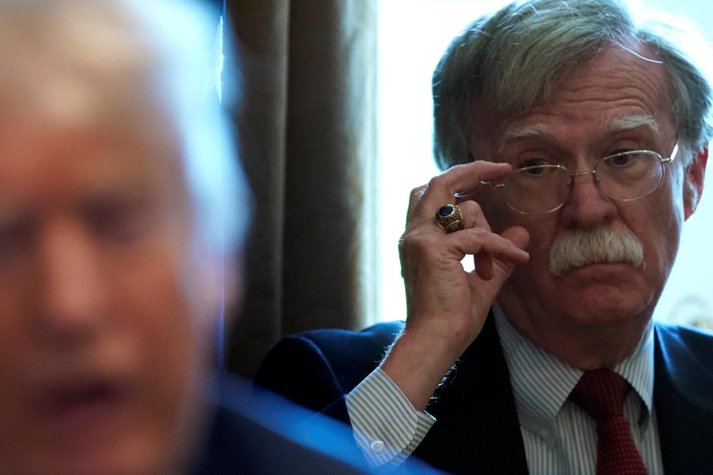 Bolton listens as Trump holds a cabinet meeting at the White House in Washington