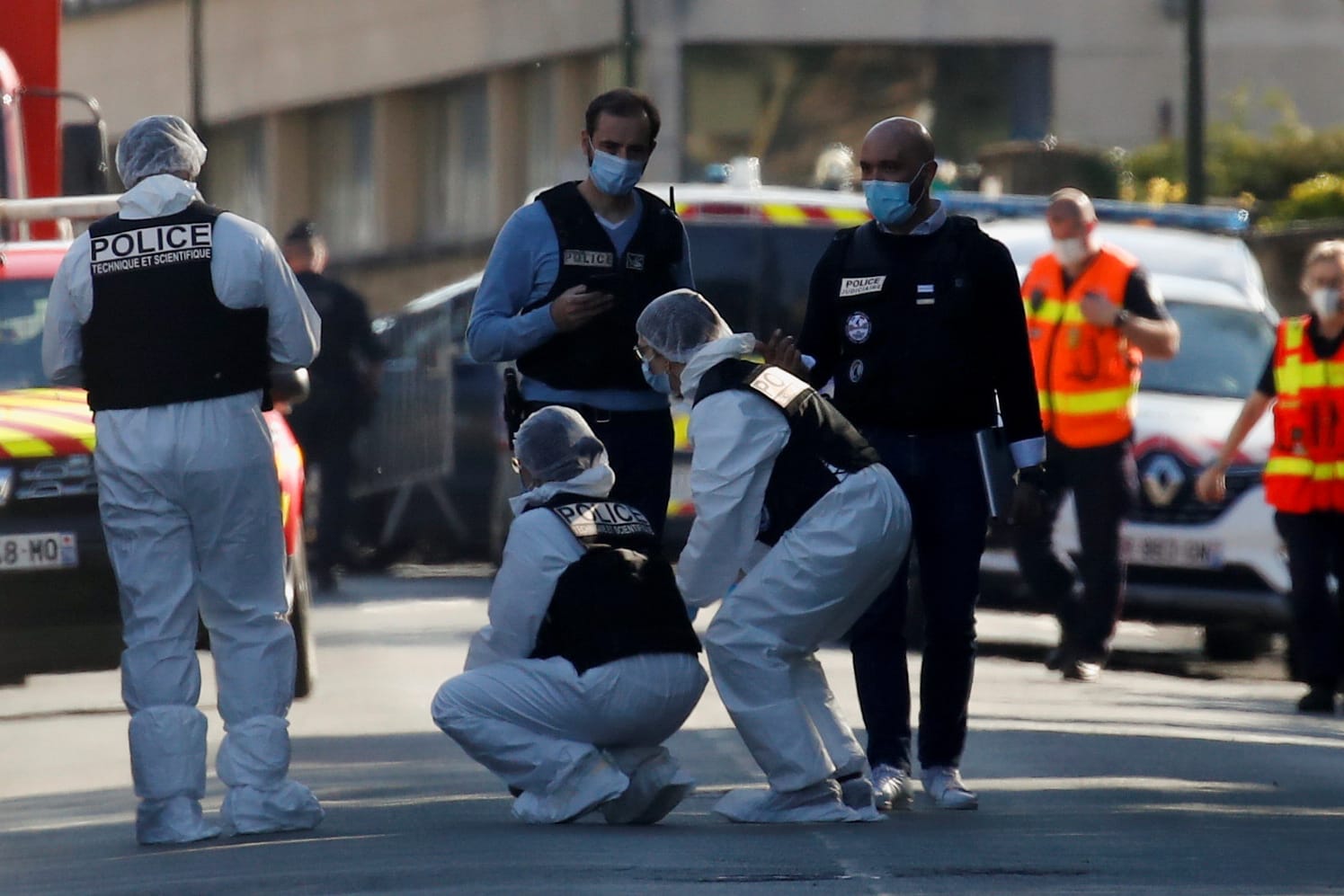 Police secure the area where an attacker stabbed a woman, in Rambouillet