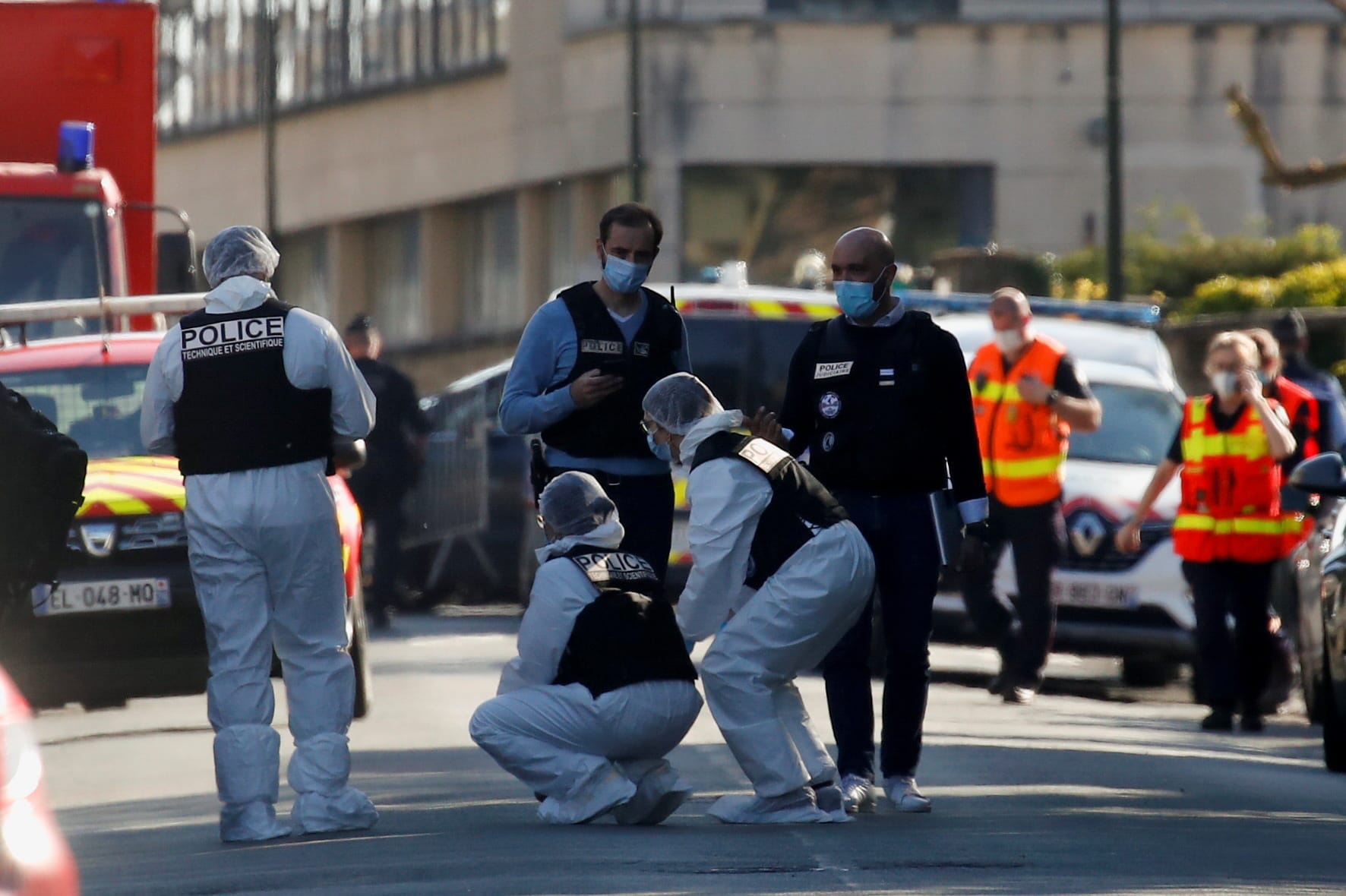 Police secure the area where an attacker stabbed a woman, in Rambouillet