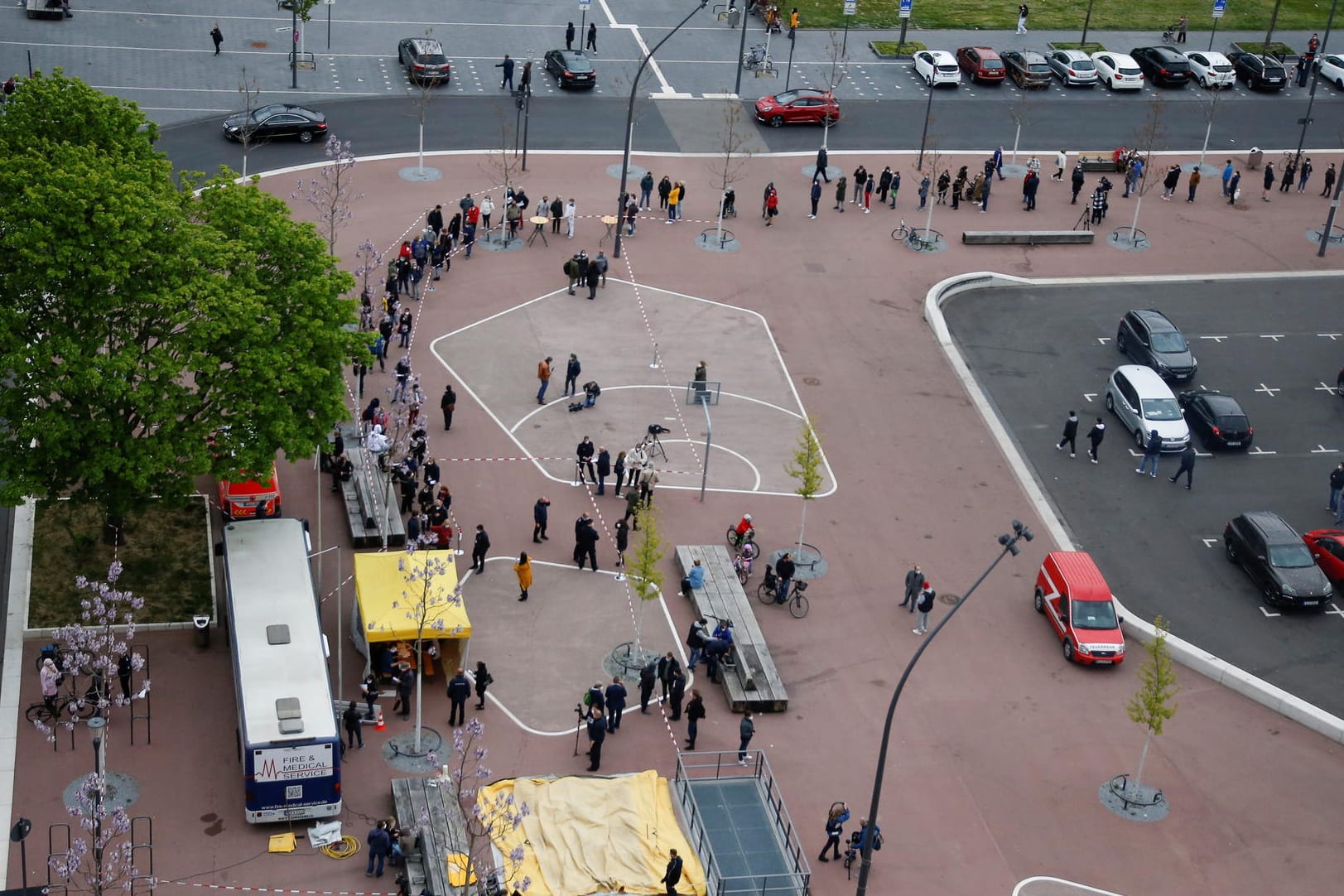 People wait to get vaccinated at mobile vaccination centre in Cologne
