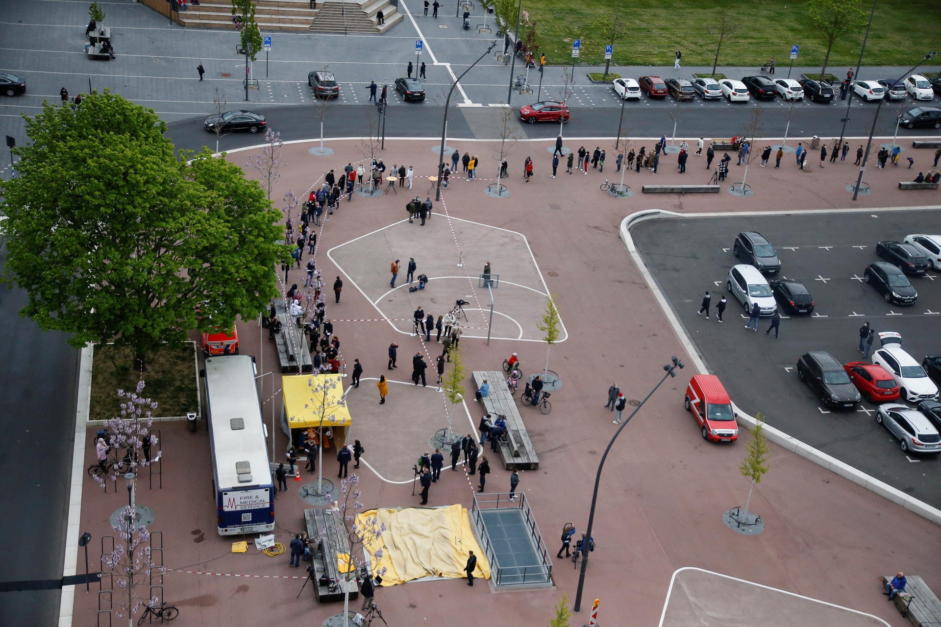 People wait to get vaccinated at mobile vaccination centre in Cologne