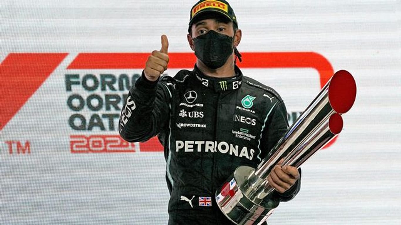 Durfte sich in Katar feiern lassen: WM-Titelverteidiger Lewis Hamilton.