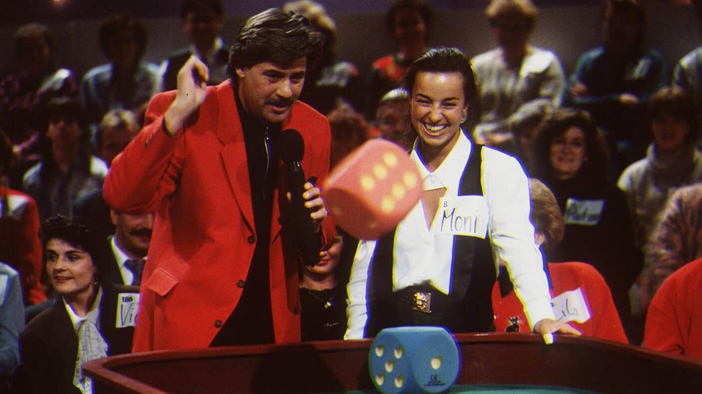Jörg Draeger: Hier ist der Moderator im Jahr 1994 mit einer Kandidatin in "Geh aufs Ganze!" zu sehen.